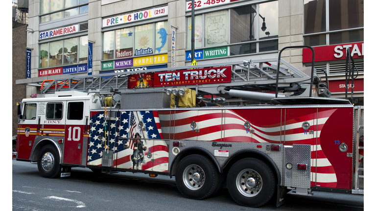 A NYFD city firetruck outside a Times Sq