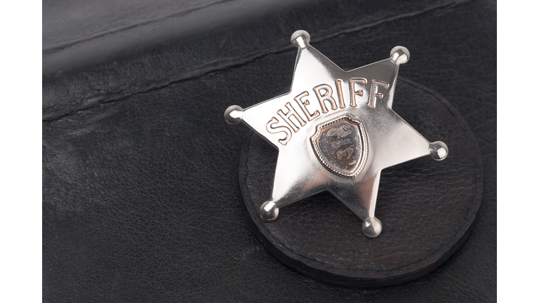 Sheriff's badge on dark background