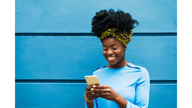 Woman smiling with smart phone