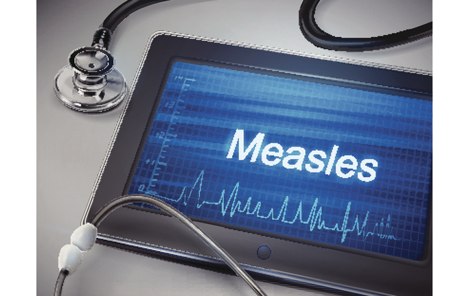 measles word displayed on tablet