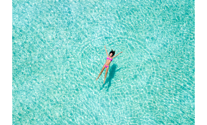 High Angle View Of Woman Swimming In Pool