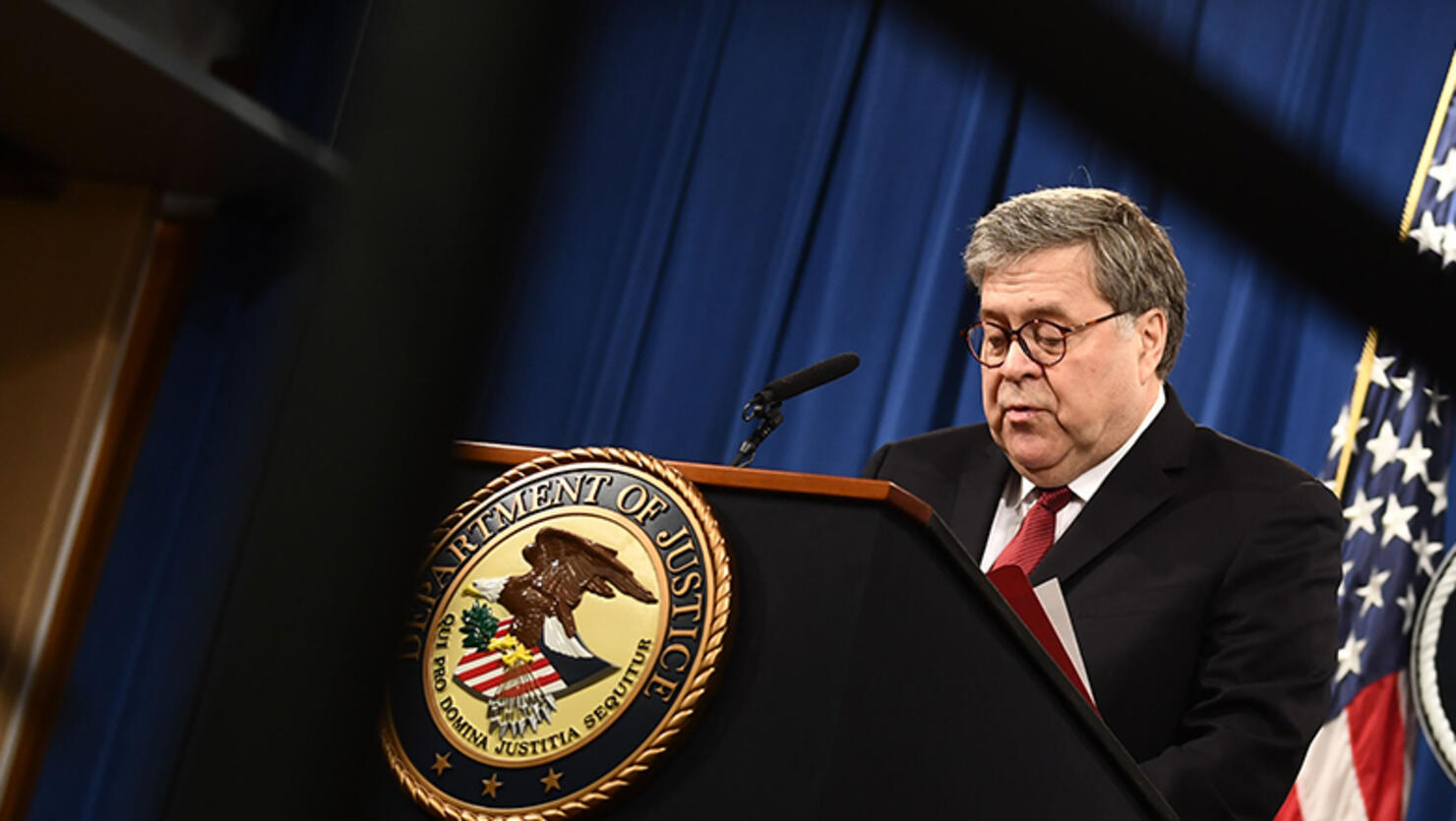 US Attorney General William Barr(L) speaks about the release of the Mueller Report at the Department of Justice April 18, 2019, in Washington, DC as US Deputy Attorney General Rod Rosenstein looks on. - The Mueller report on Russian interference in the 20