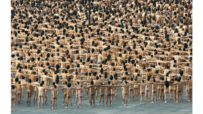 Thousands of people pose in the nude for
