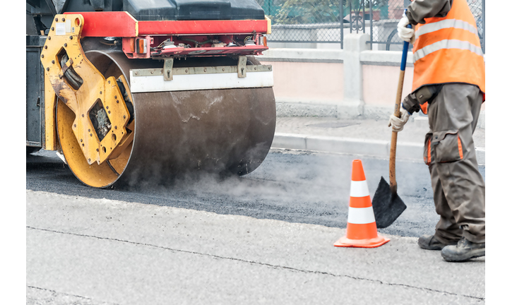 Low Section Of Man Working On Road