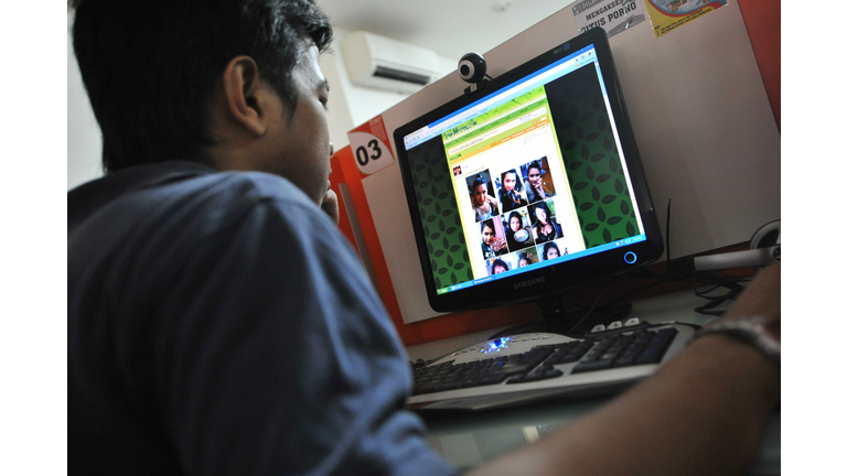 A man browses at pictures of Japanese po