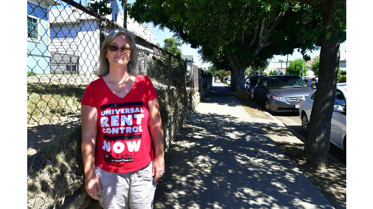 Community activist Elizabeth Blaney is interviewed in front of the apartment block where, with no rent control due to the year it was built, the landlord has increased some rentals by as much as $800, August 3, 2017 in the Boyle Heights neighborhood of Los Angeles, California. 