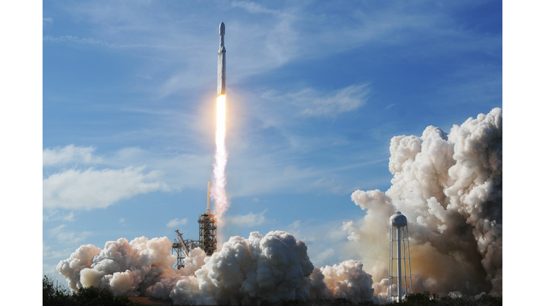 The SpaceX Falcon Heavy launches from Pad 39A at the Kennedy Space Center in Florida, on February 6, 2018, on its demonstration mission. The world's most powerful rocket, SpaceX's Falcon Heavy, blasted off Tuesday on its highly anticipated maiden test flight, carrying CEO Elon Musk's cherry red Tesla roadster to an orbit near Mars. Screams and cheers erupted at Cape Canaveral, Florida as the massive rocket fired its 27 engines and rumbled into the blue sky over the same NASA launchpad that served as a base for the US missions to Moon four decades ago. Photo credit: JIM WATSON/AFP/Getty Images