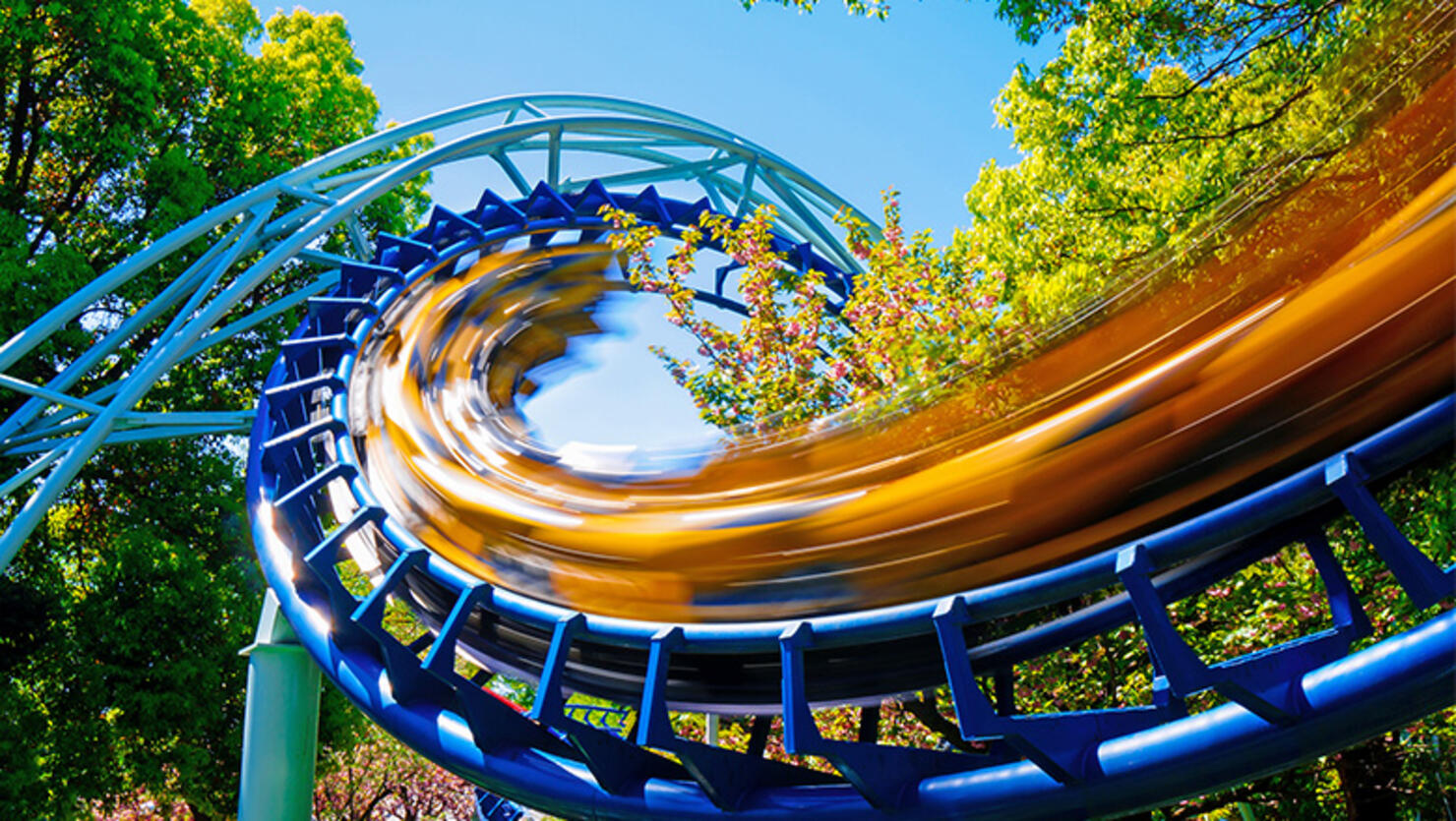 Low Angle View Of Rollercoaster At Amusement Park