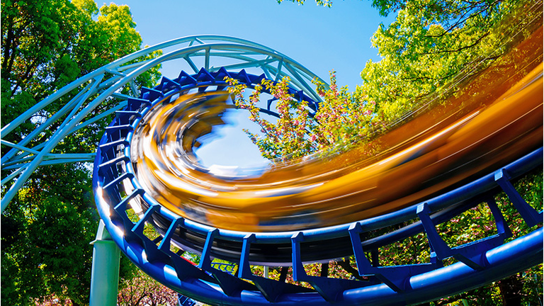 Low Angle View Of Rollercoaster At Amusement Park