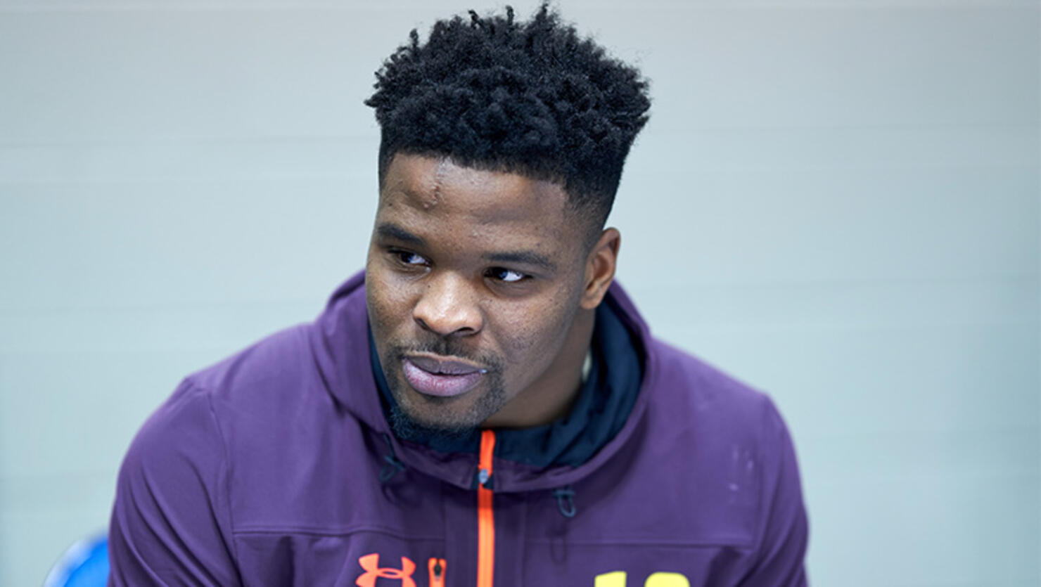 Arkansas linebacker Dre Greenlaw answers questions from the media during the NFL Scouting Combine