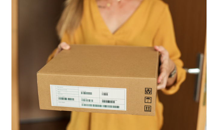 Young woman receiving a package