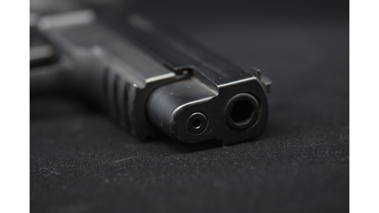 A black pistol  (gun)