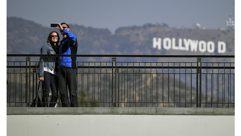 Tourists take photos in front of the ico