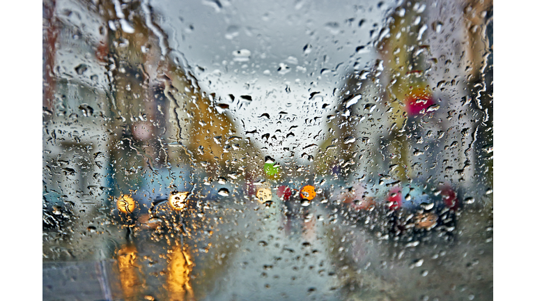 Car windshield with rain drops during rain
