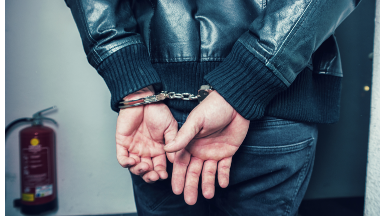 Midsection Of Person Wearing Handcuffs