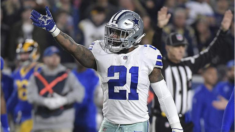 On fourth-and-1, Dallas Cowboys head coach Jason Garrett goes for it and running back Ezekiel Elliott (21) picks it up during the first quarter against the Los Angeles Rams in the NFL Divisional Round at the Los Angeles Memorial Coliseum on Saturday, Jan.