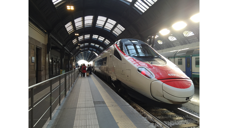 People By High Speed Train At Railroad Station Platform