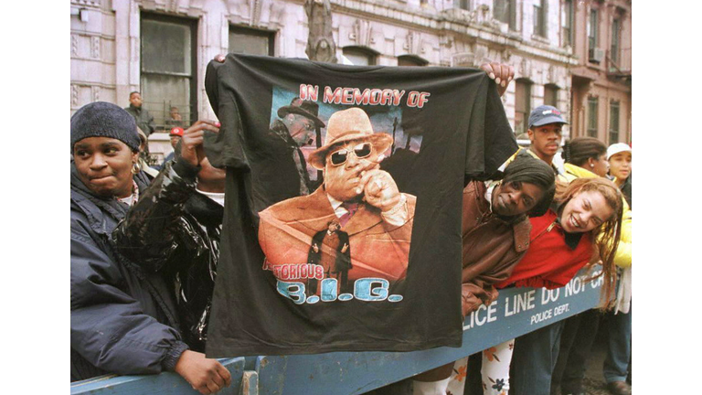A man displays a T-shirt tribute to rapper Biggie