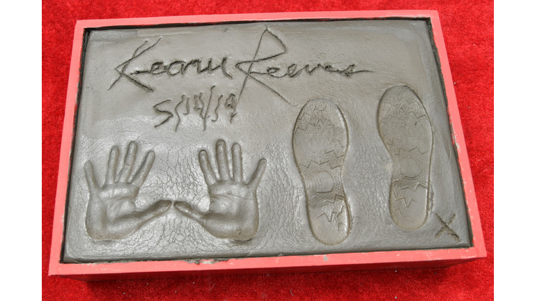 Keanu Reeves Places His Hand Prints In Cement At TCL Chinese Theatre IMAX Forecourt