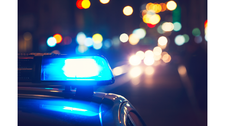 Close-Up Of Blue Siren On Police Car At Night