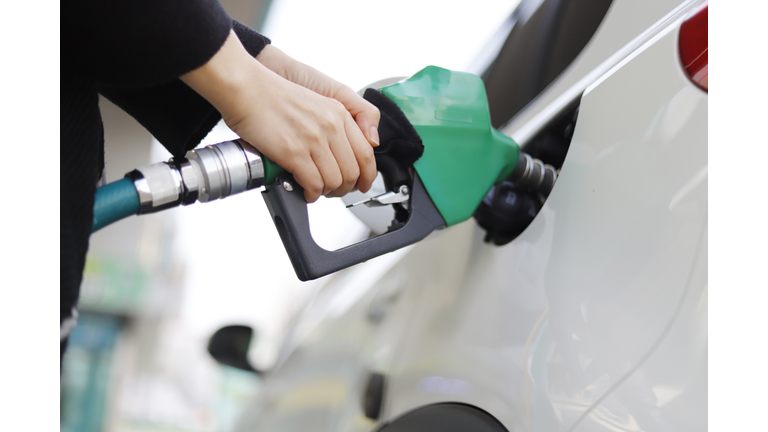 Cropped Hand Of Woman Refueling Car