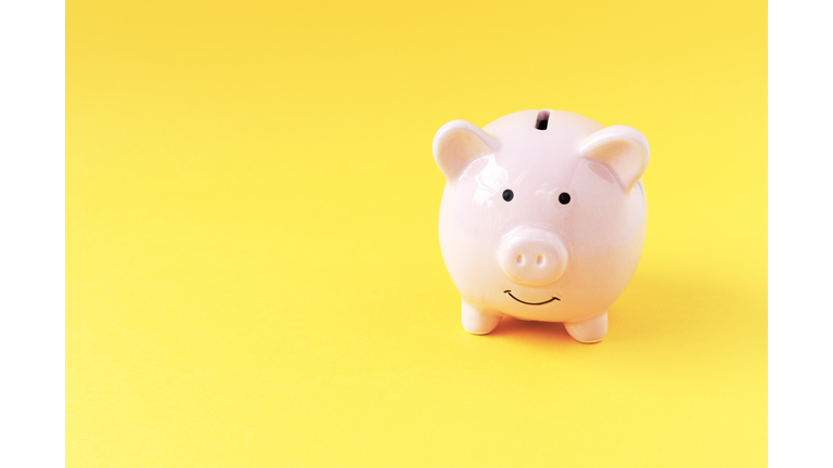 Piggy Bank on Yellow Background