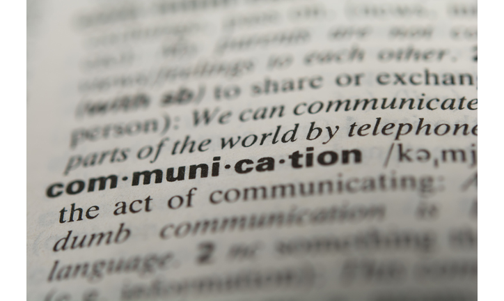 Close-Up Of Communication Text In Dictionary