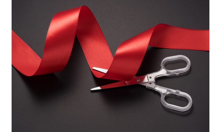 Scissors Cutting Red Ribbon