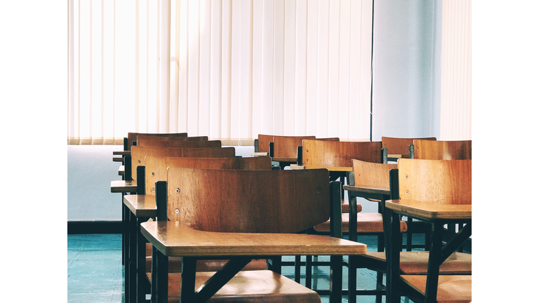 Empty Chairs With Desk In Classroom