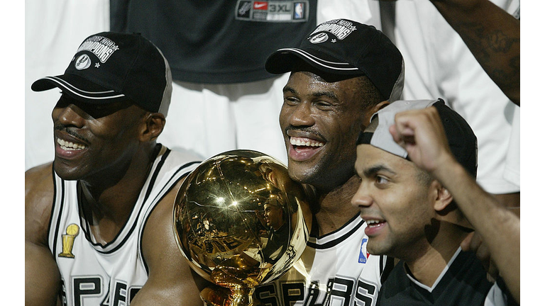 Robinson celebrates with the trophy