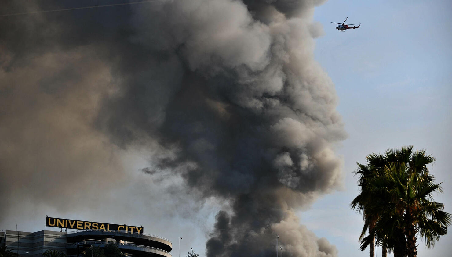 Smoke rises over burning structures at U