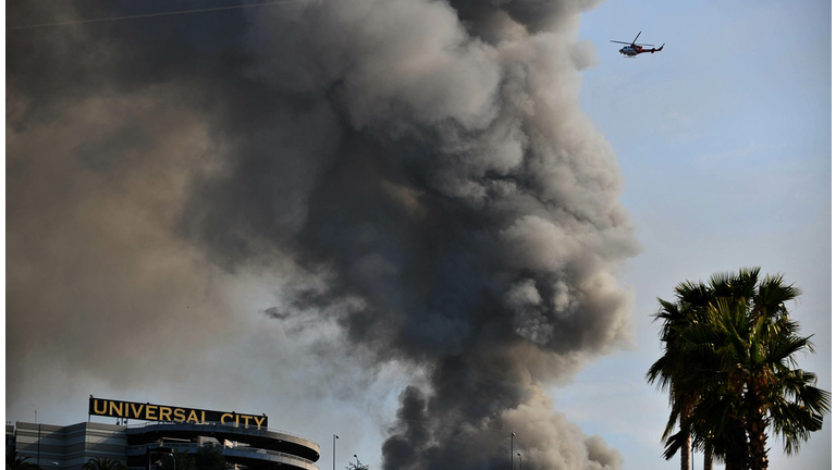 Smoke rises over burning structures at U