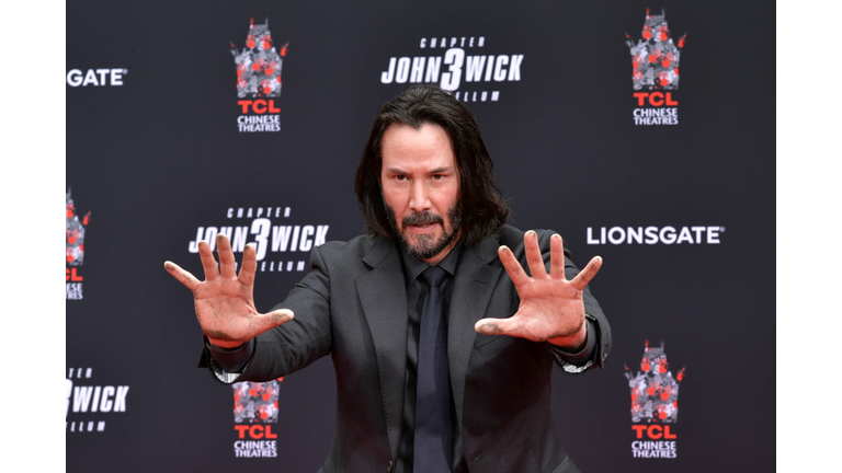 Keanu Reeves Places His Hand Prints In Cement At TCL Chinese Theatre IMAX Forecourt
