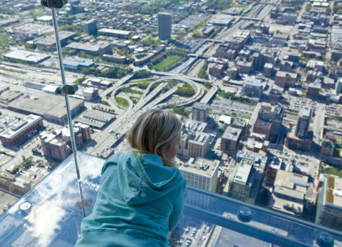 Tourist admiring view of Chicago from Sears Tower