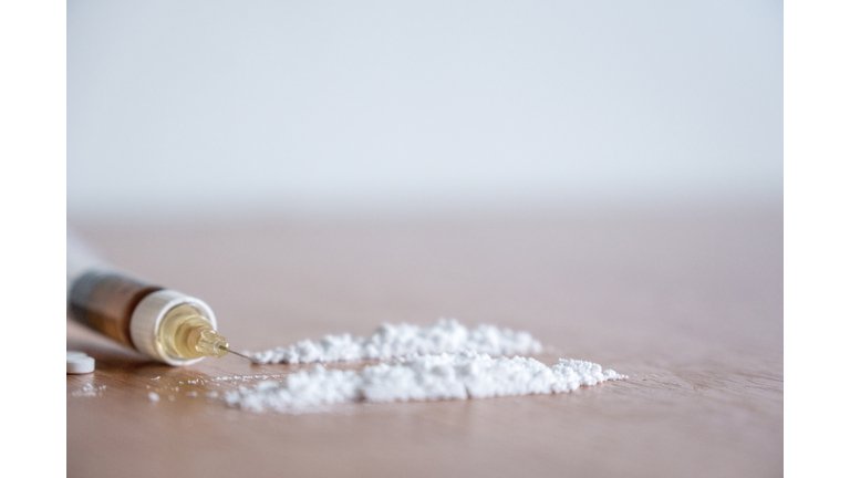 Heroin syringe needle with heroin and cocaine powder