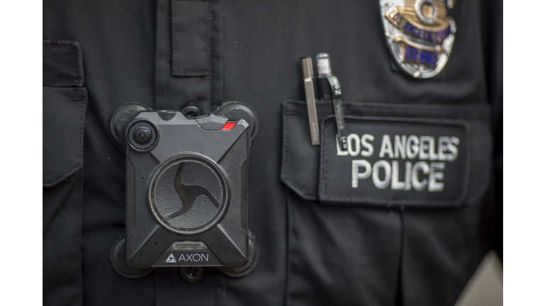 FEBRUARY 18: A Los Angeles police officer wear an AXON body camera during the Immigrants Make America Great March to protest actions being taken by the Trump administration on February 18, 2017 in Los Angeles, California. Protesters are calling for an end to stepped up ICE raids and deportations, and that health care be provided for documented and undocumented people. (Photo by David McNew/Getty Images)