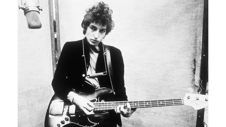 Bob Dylan Holding Bass Guitar