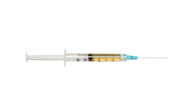 hypodermic needle with yellow liquid
