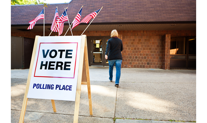 Woman Voter Entering Voting Polling Place for USA Government Election