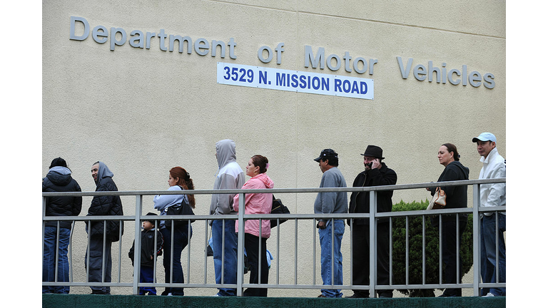 People wait in line outside of the State