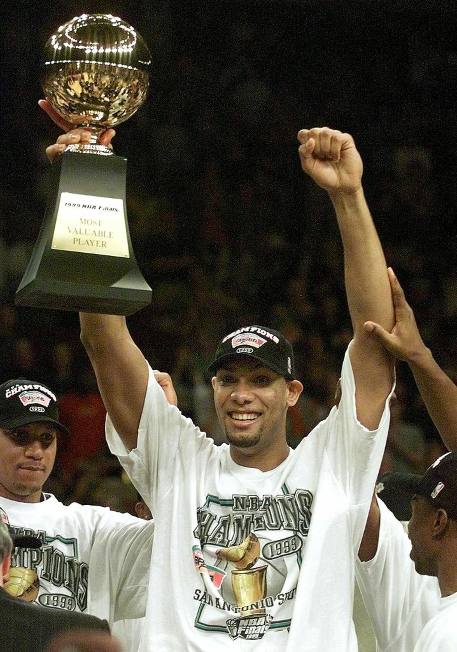 Tim Duncan holds MVP trophy