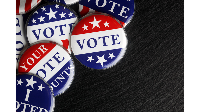 Red, white, and blue vote buttons background