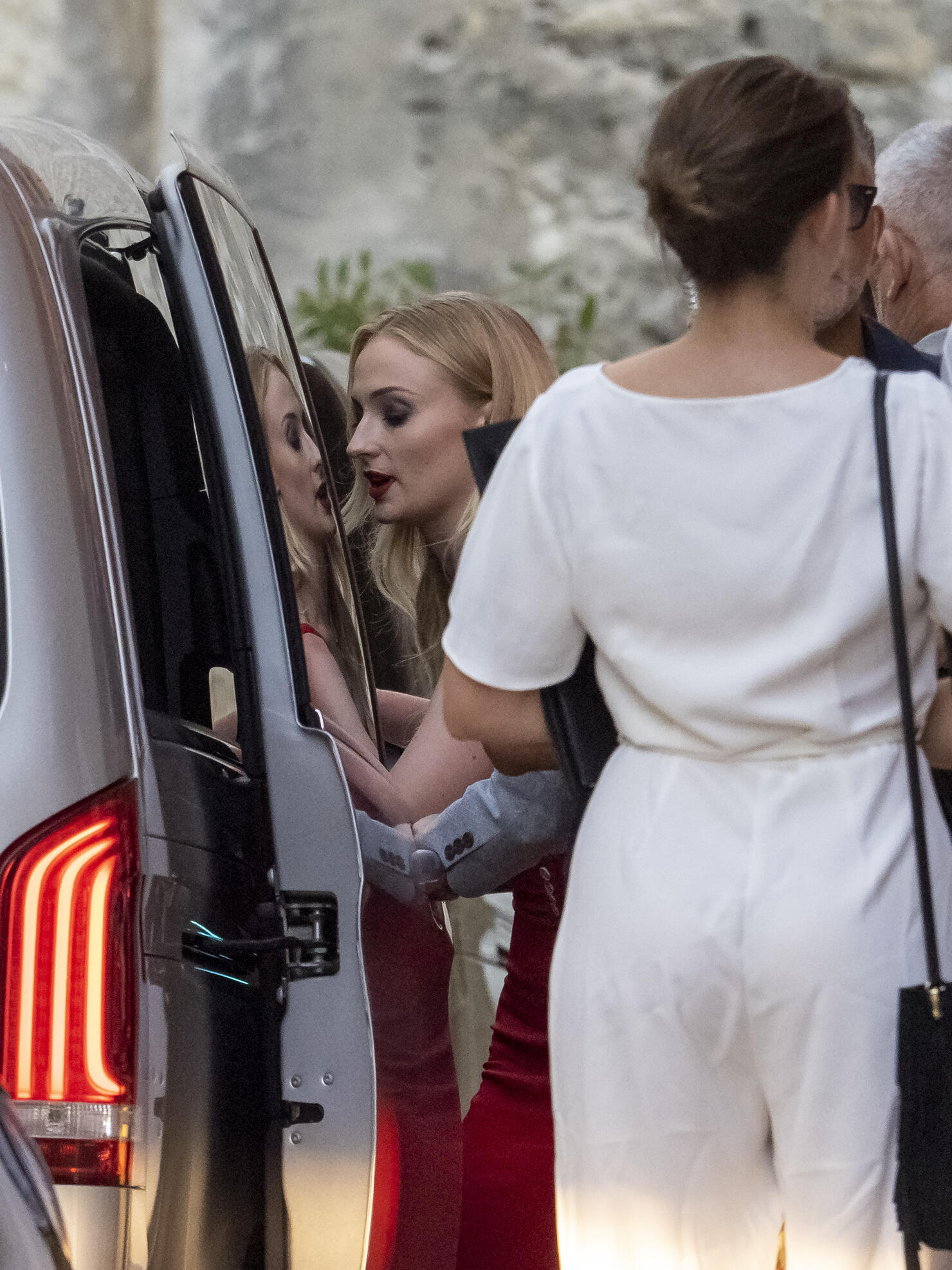 Joe Jonas And Sophie Turner Match In Red As Guests Wear White At