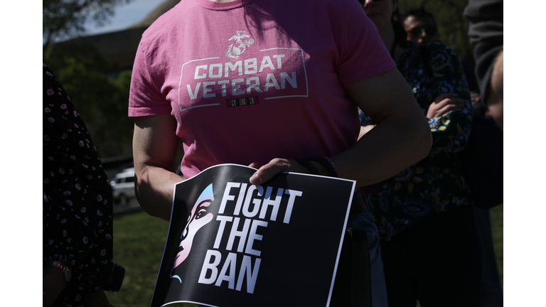 Activists participate in a rally at the Reflecting Pool of the U.S. Capitol April 10, 2019 in Washington, DC. Democratic lawmakers joined activists to rally against the transgender military service ban. (Photo by Alex Wong/Getty Images)