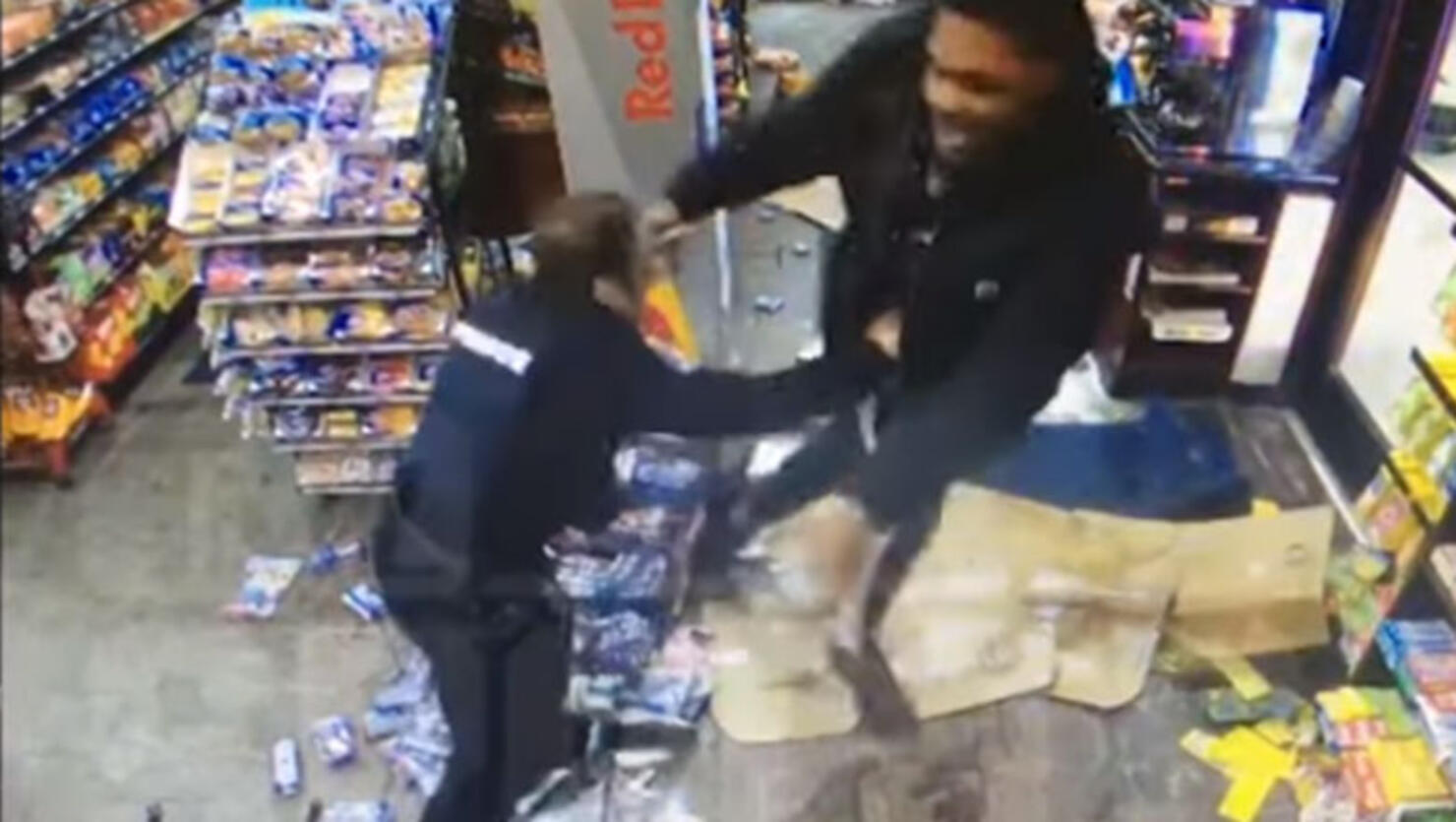 Malik McDowell and a police officer fighting inside a convenience store 