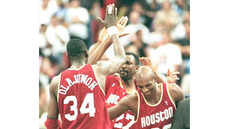 Houston Rockets Hakeem Olajuwon gets mobbed by tea