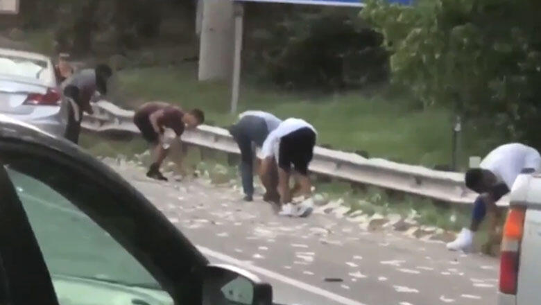 Drivers Run Onto Busy Highway To Grab Money That Fell Out Of Armored Truck - Thumbnail Image