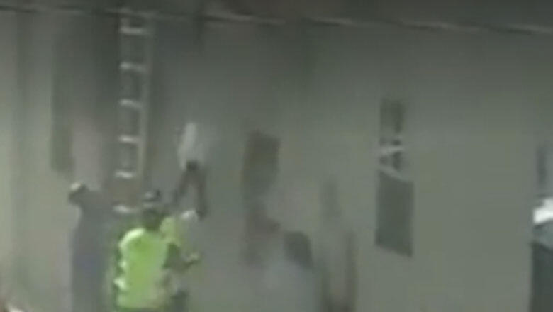 Dramatic Video Shows Roofer Catching Kids Dropped From Burning Building - Thumbnail Image