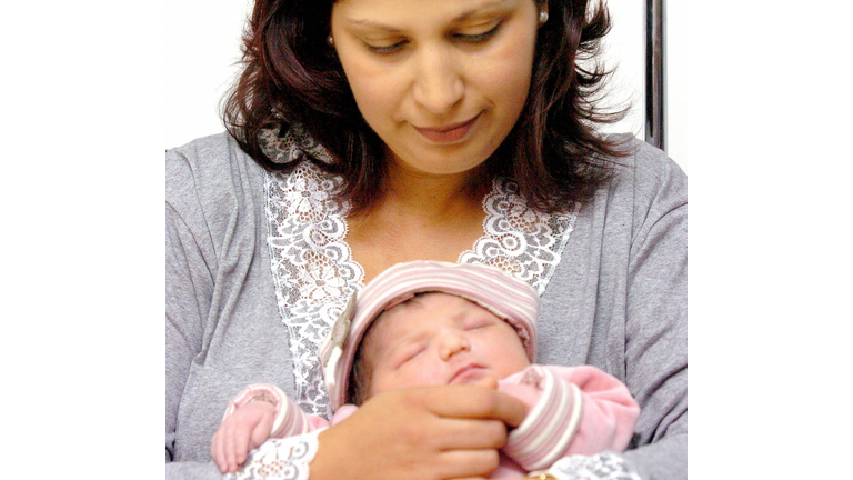 Ouarda Touirat holds her new born daught
