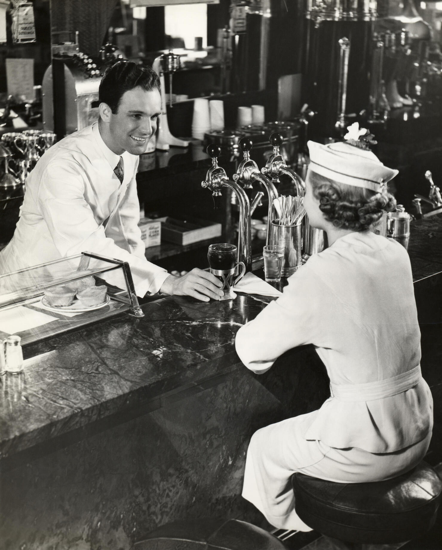 Woman sitting at lunch counter